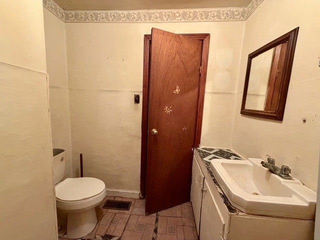 9554 Brooksie Thompson Road Bath Springs, TN 38311 - Photo 27 of 45 a bathroom with a sink a toilet and shower
