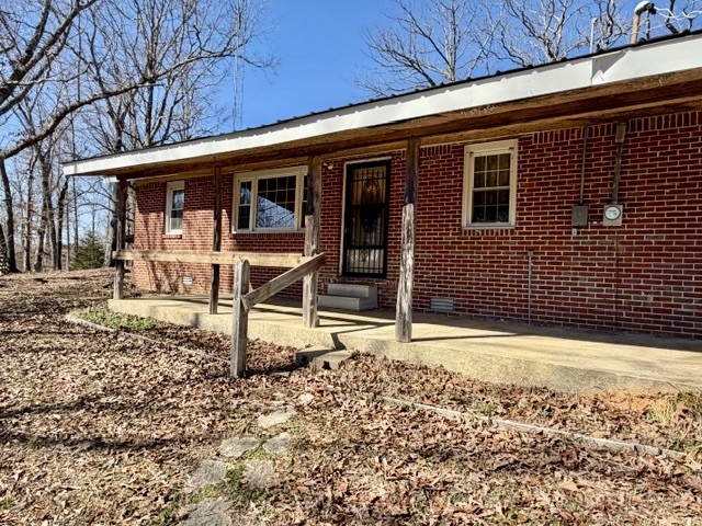 9554 Brooksie Thompson Road Bath Springs, TN 38311 - Photo 3 of 45 a front view of a house with garden