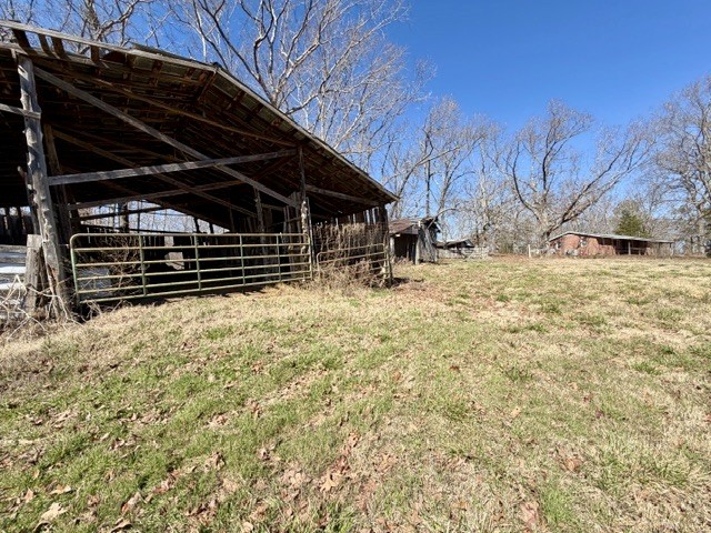 9554 Brooksie Thompson Road Bath Springs, TN 38311 - Photo 43 of 45 a view of a backyard of the house