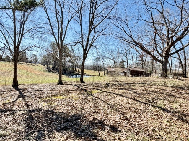 9554 Brooksie Thompson Road Bath Springs, TN 38311 - Photo 7 of 45 a view of road with snow on the road