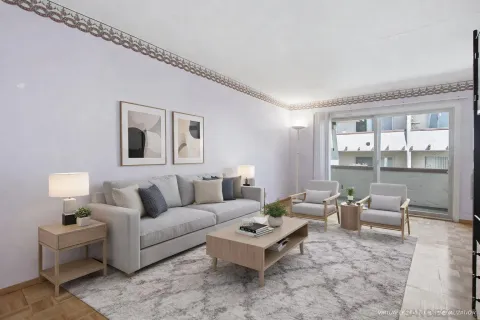a view of a big room with window and carpet