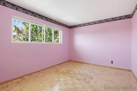 a view of a house with a flower garden