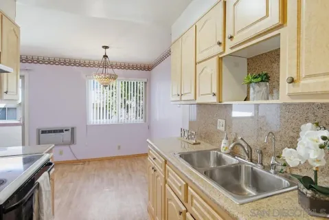 a kitchen with a stove and cabinets