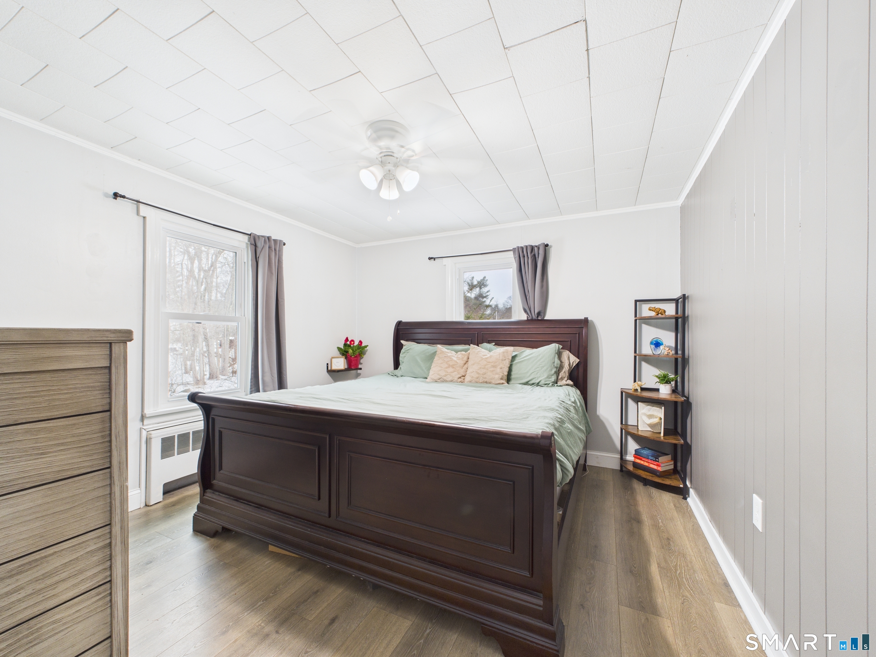 10 1st Street Thompson, CT 06255 - Photo 13 of 28 a bedroom with a bed and a bookshelf