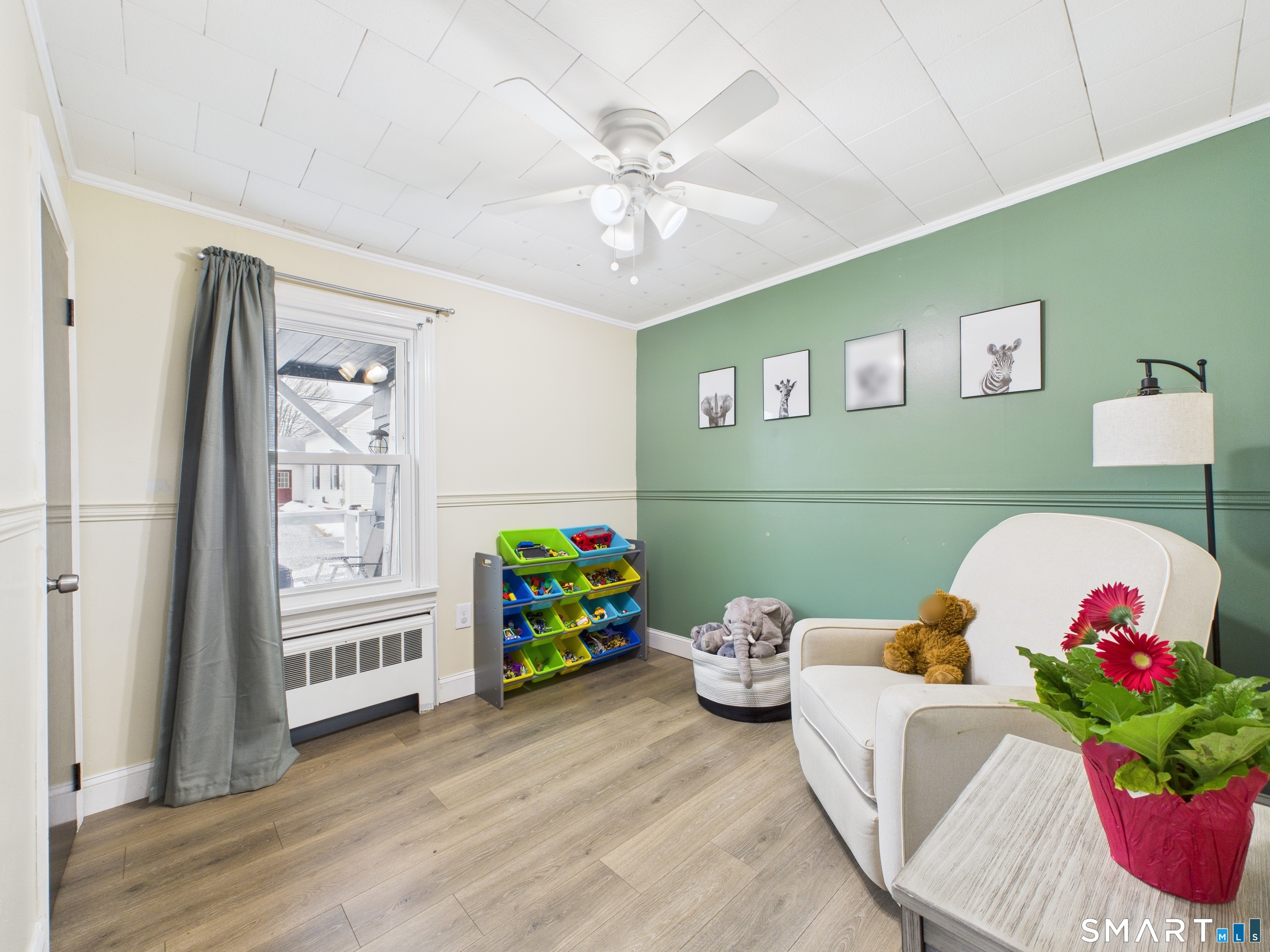 10 1st Street Thompson, CT 06255 - Photo 18 of 28 a living room with furniture and a baby bed