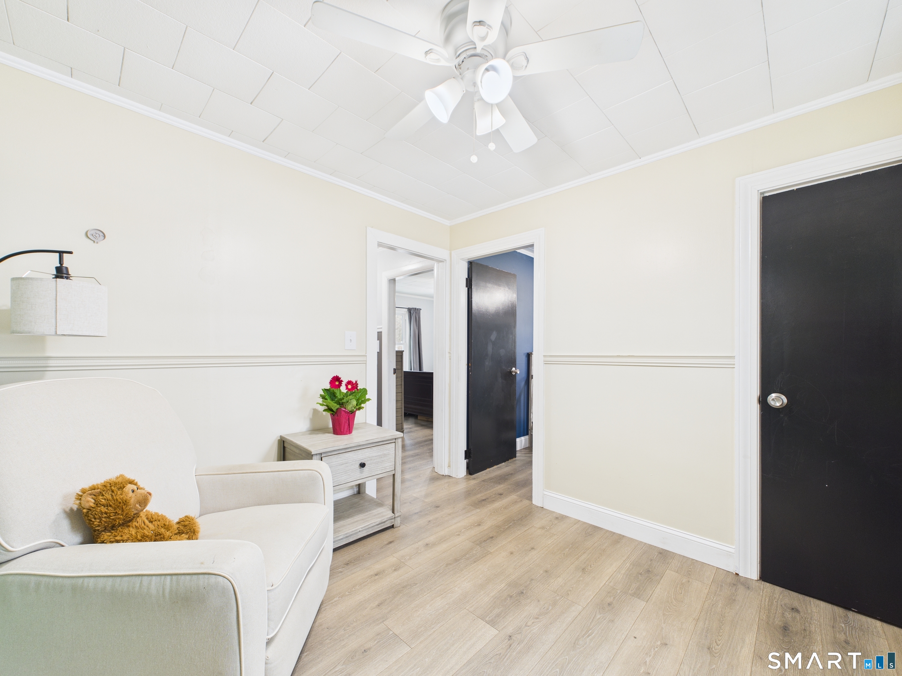 10 1st Street Thompson, CT 06255 - Photo 20 of 28 a living room with furniture and a chandelier