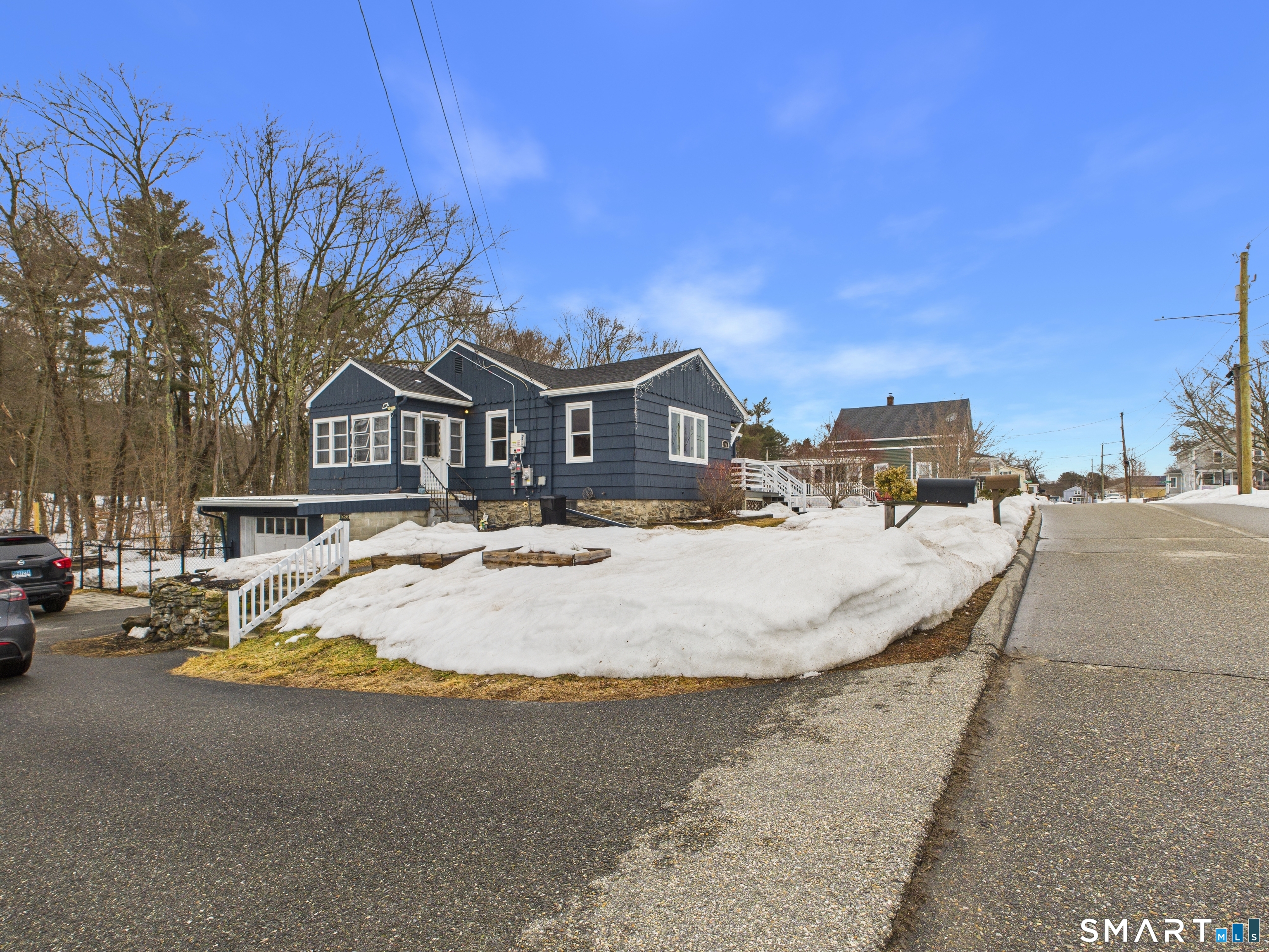 10 1st Street Thompson, CT 06255 - Photo 2 of 28 a view of swimming pool with outdoor seating and house in the background