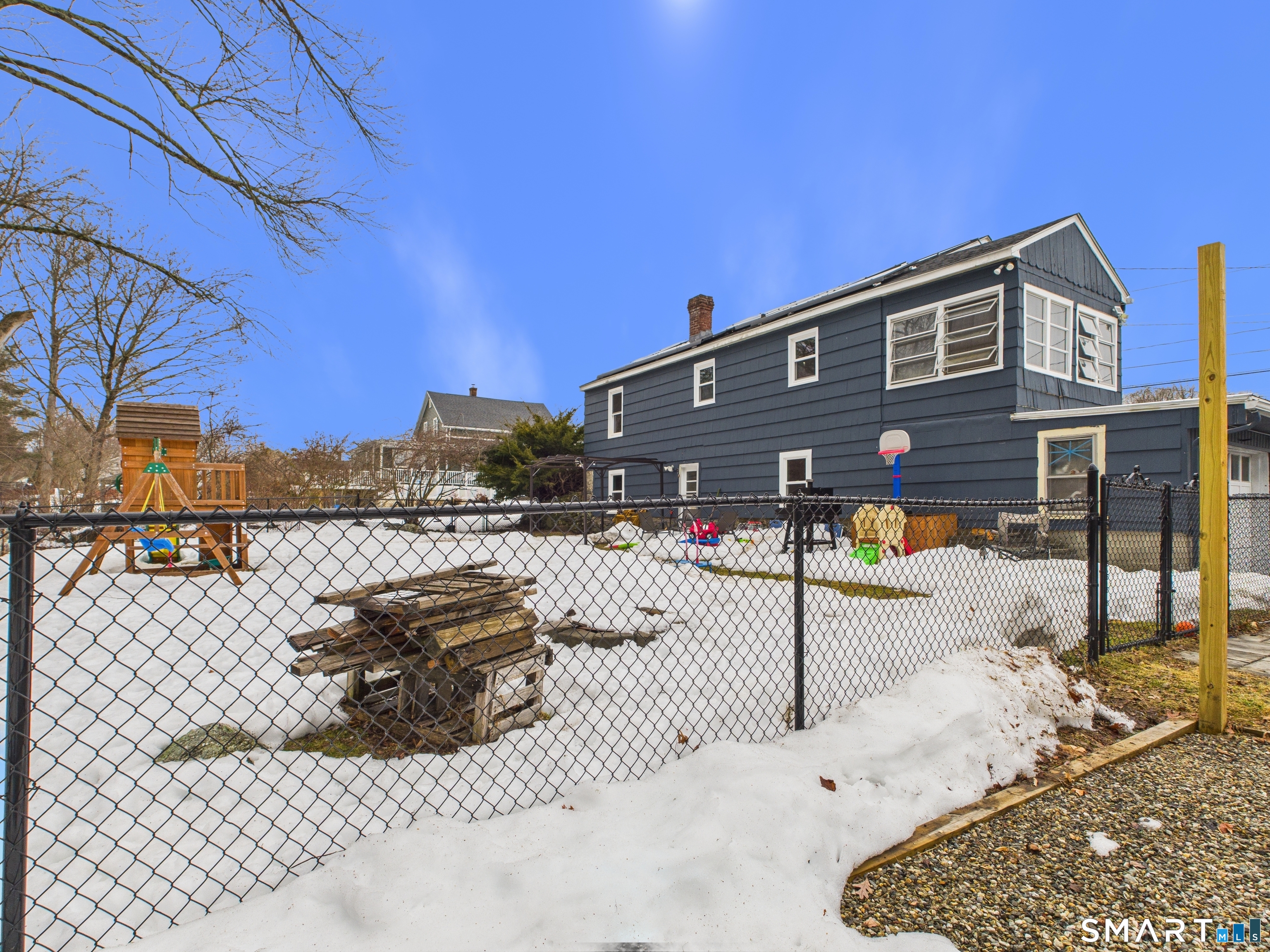 10 1st Street Thompson, CT 06255 - Photo 26 of 28 a view of a house with a wooden fence