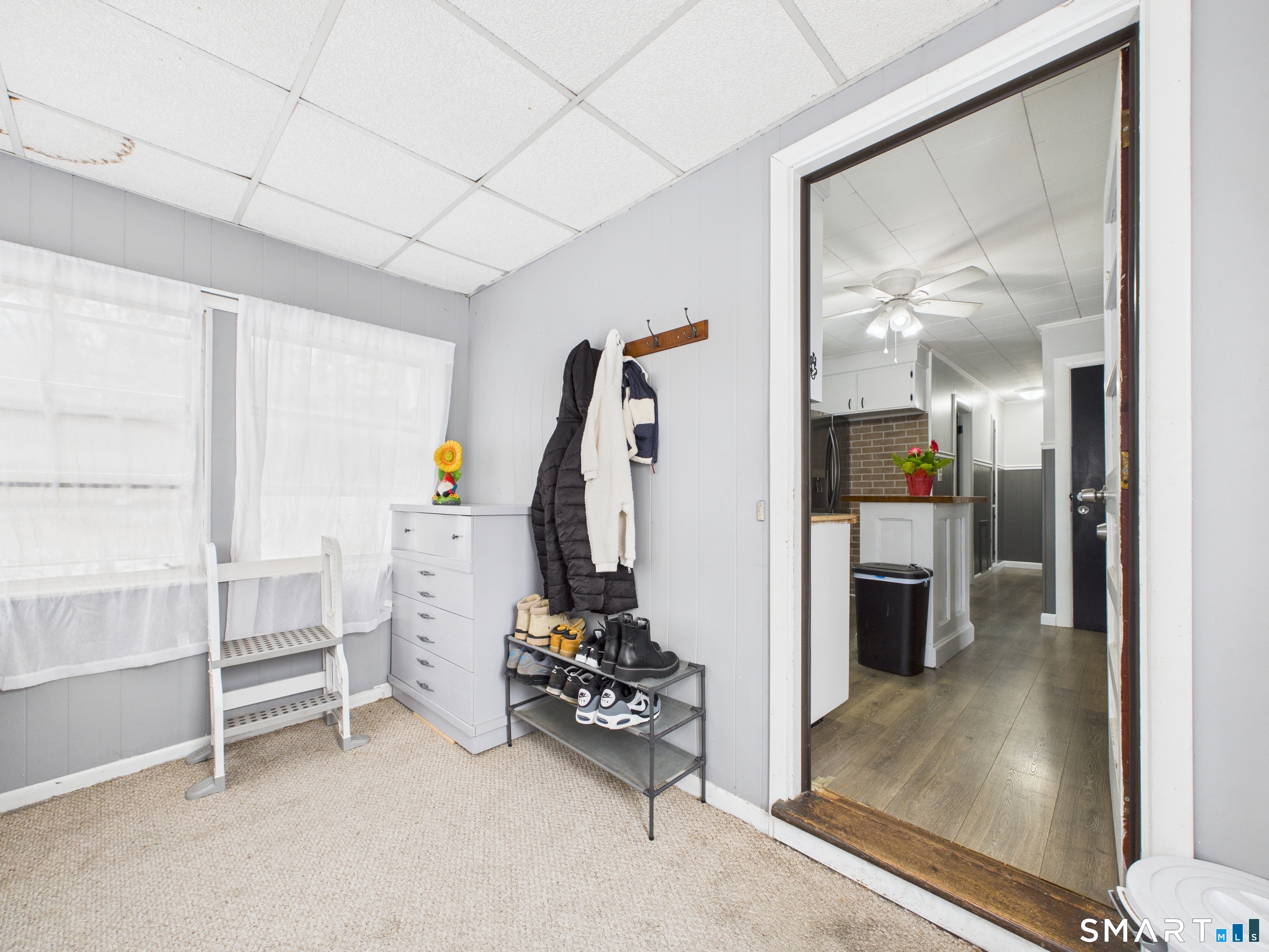 10 1st Street Thompson, CT 06255 - Photo 4 of 28 a view of a room with gym equipment and windows