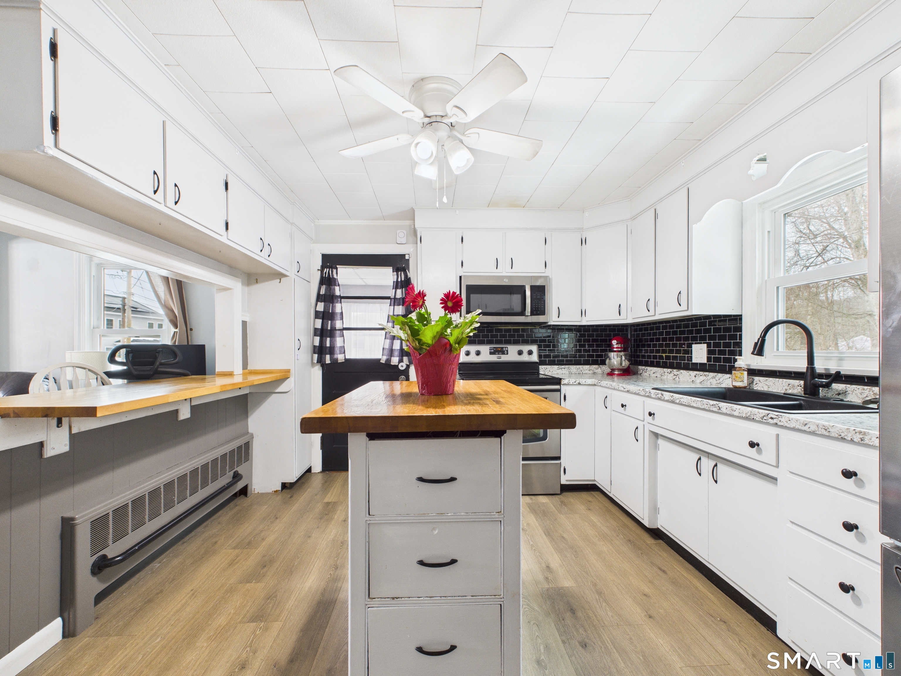 10 1st Street Thompson, CT 06255 - Photo 6 of 28 a kitchen with granite countertop a sink appliances cabinets and furniture