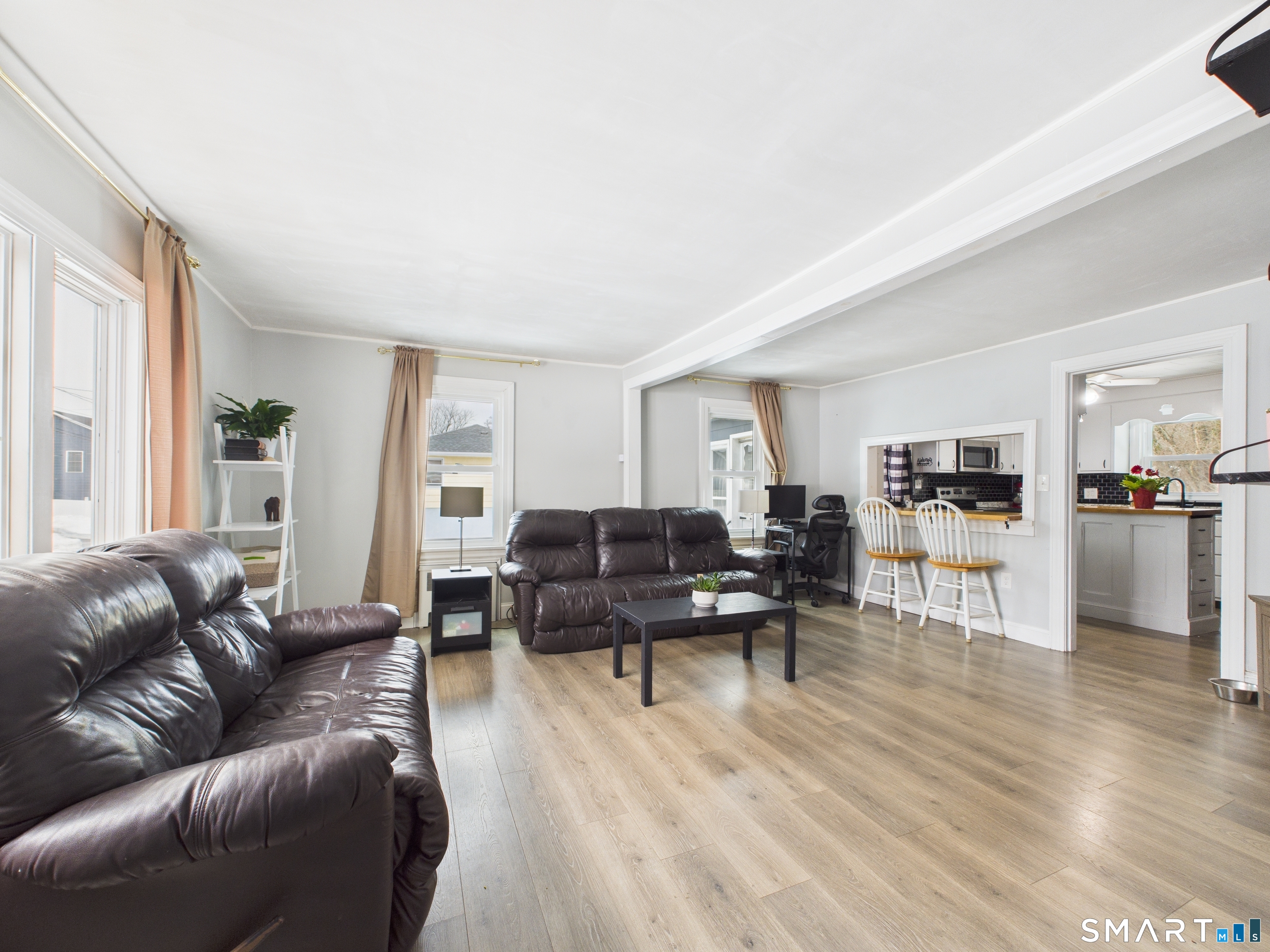 10 1st Street Thompson, CT 06255 - Photo 8 of 28 a living room with furniture window and wooden floor