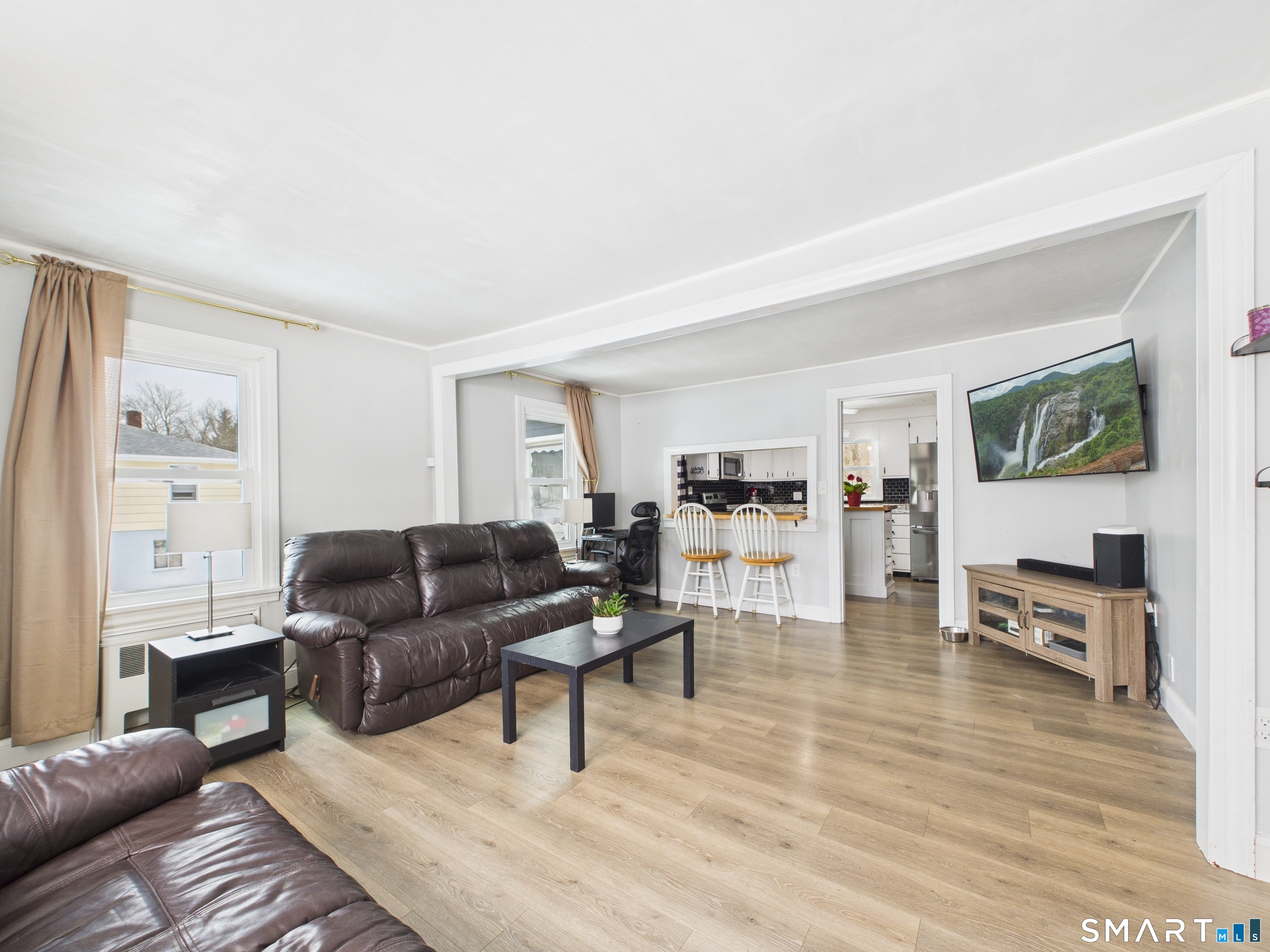 10 1st Street Thompson, CT 06255 - Photo 9 of 28 a living room with furniture and a wooden floor