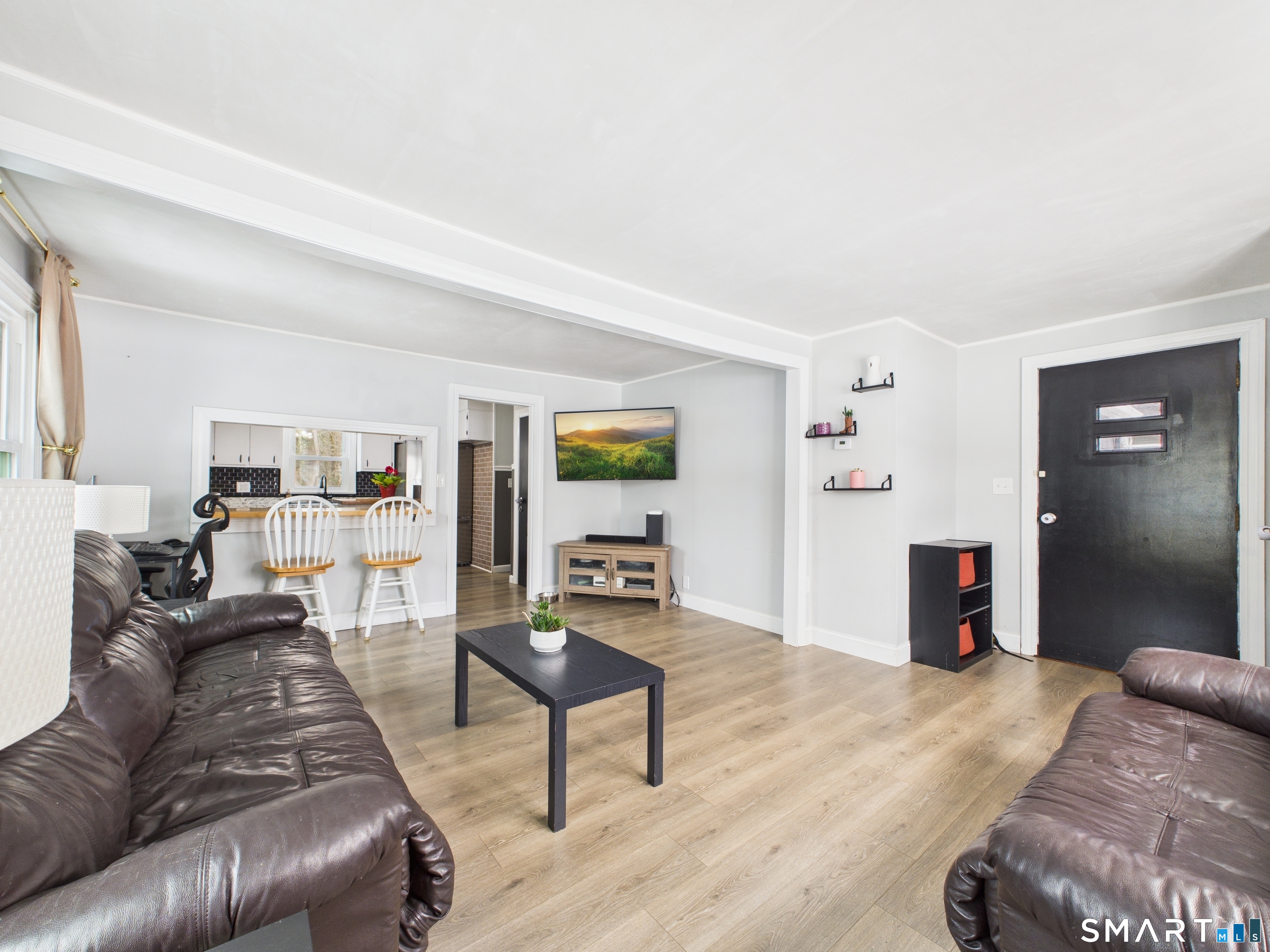 10 1st Street Thompson, CT 06255 - Photo 10 of 28 a living room with furniture and a wooden floor