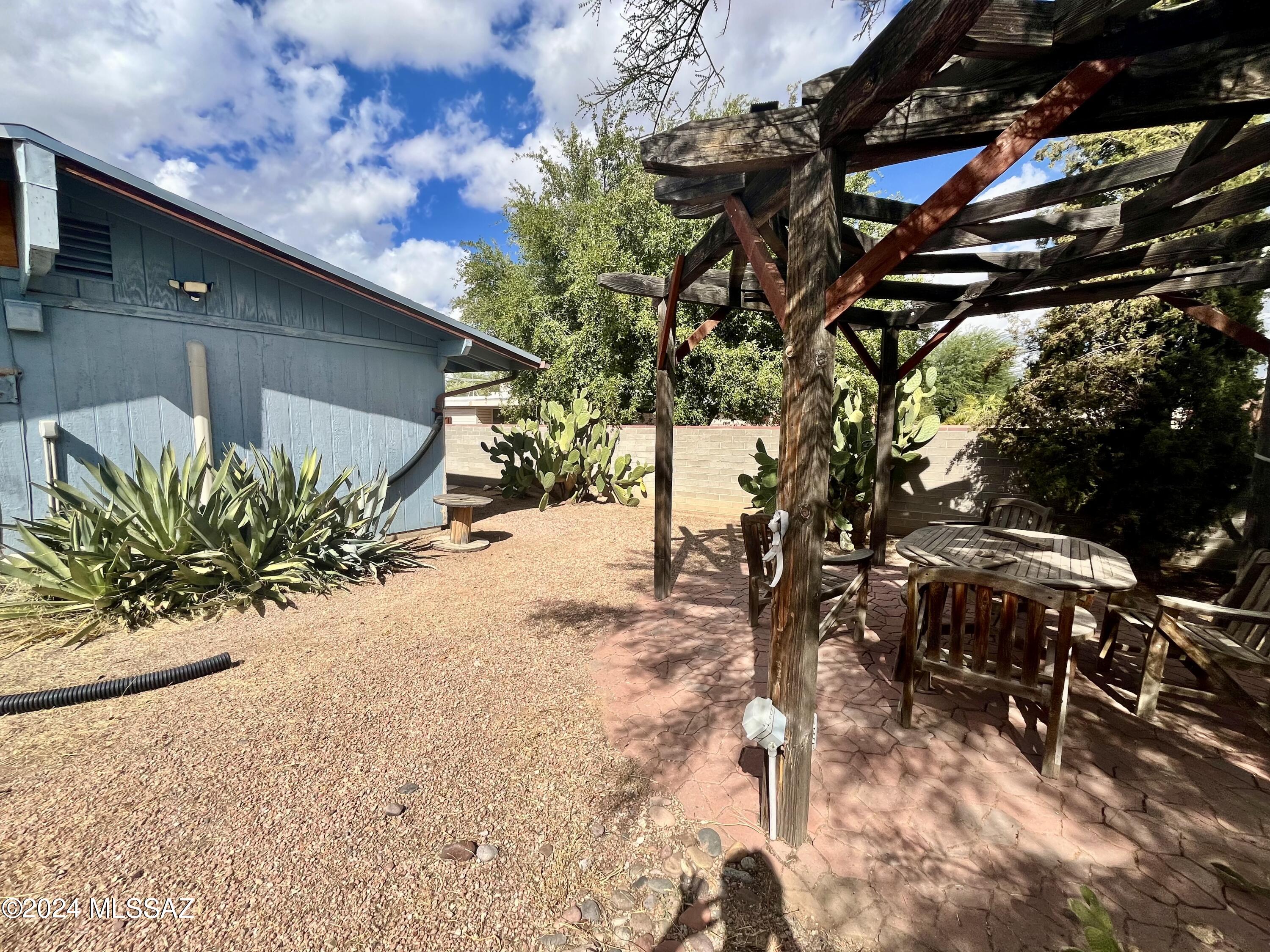 2118 North Rita Avenue Tucson, AZ 85716 - Photo 14 of 17 a street view with a tree