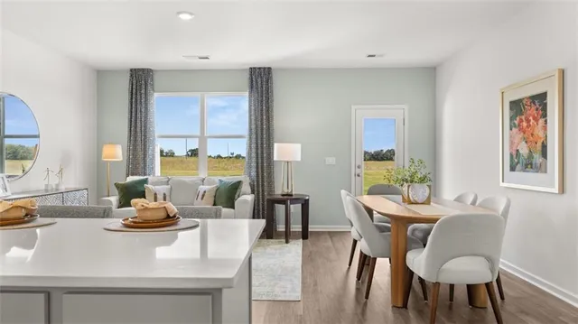 a dining room with furniture and window