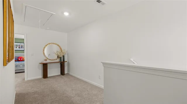 a room with cabinet a mirror and a glass door