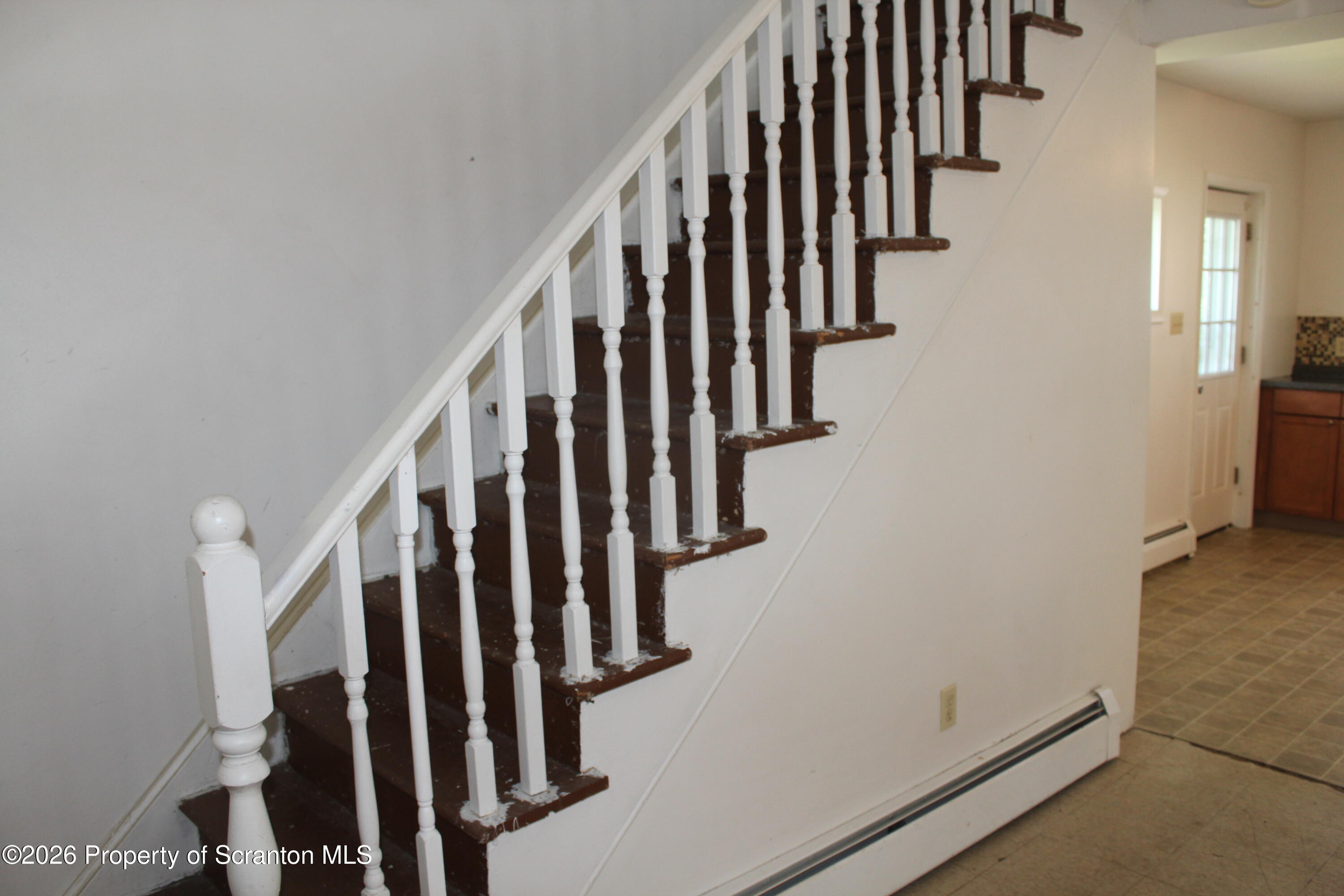 1608 Prospect Avenue Scranton, PA 18505 - Photo 13 of 30 a view of staircase with lots of frames on wall and stairs