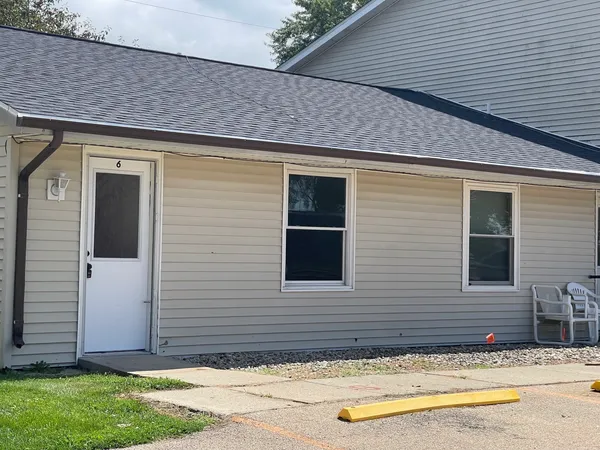 a view of front door and small yard
