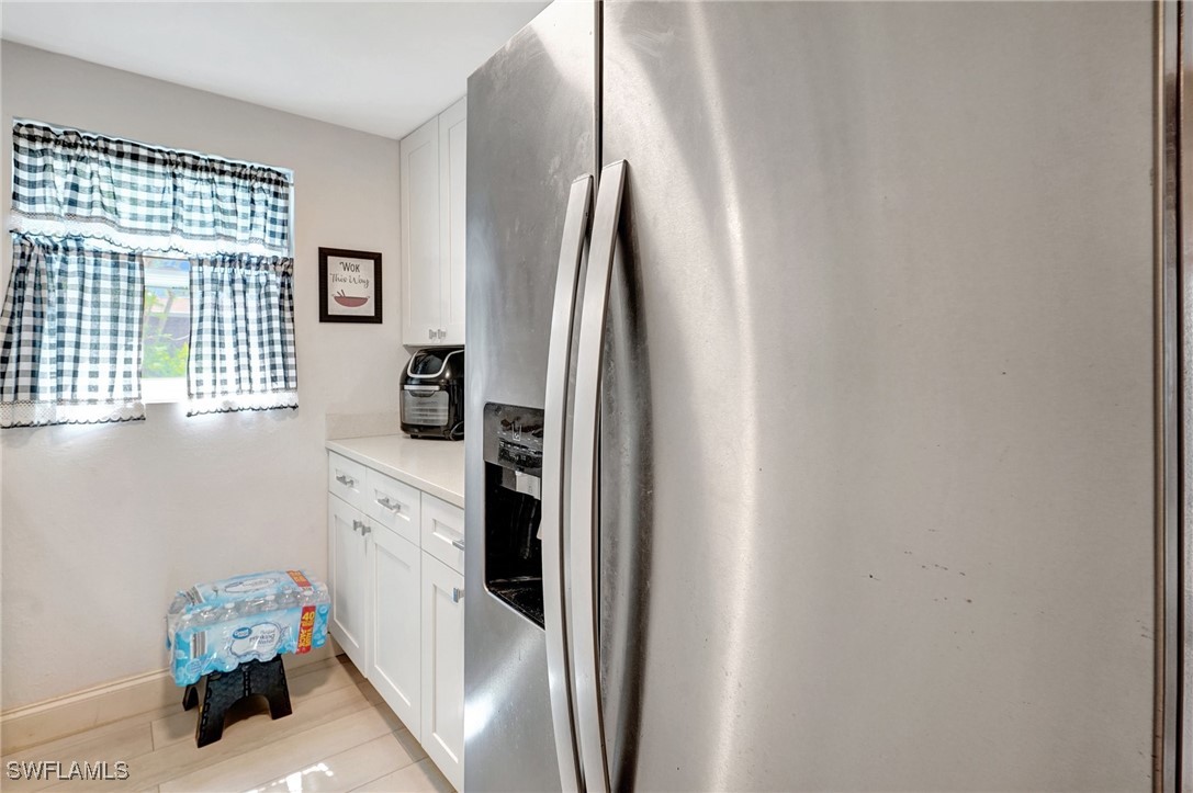 2153 Twin Brooks Road North Fort Myers, FL 33917 - Photo 11 of 31 a kitchen with stainless steel appliances granite countertop a refrigerator and a sink