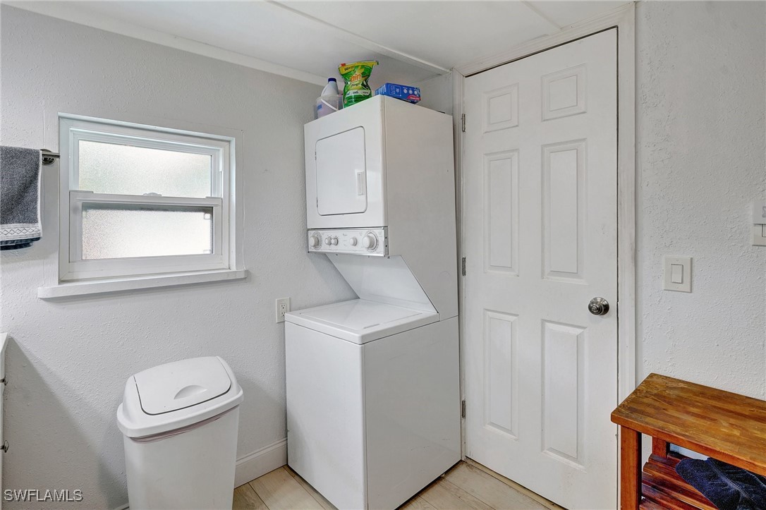 2153 Twin Brooks Road North Fort Myers, FL 33917 - Photo 18 of 31 a bathroom with a toilet a sink a vanity and window