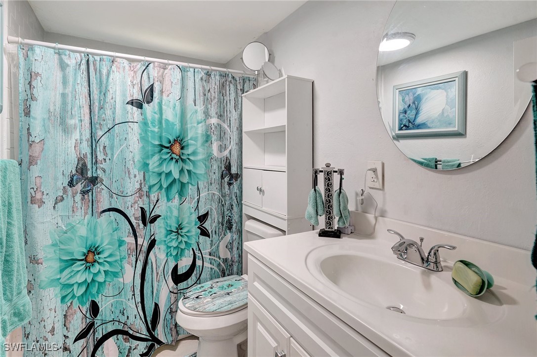 2153 Twin Brooks Road North Fort Myers, FL 33917 - Photo 20 of 31 a bathroom with a granite countertop sink and a mirror