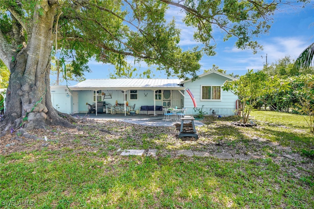2153 Twin Brooks Road North Fort Myers, FL 33917 - Photo 2 of 31 a front view of a house with garden