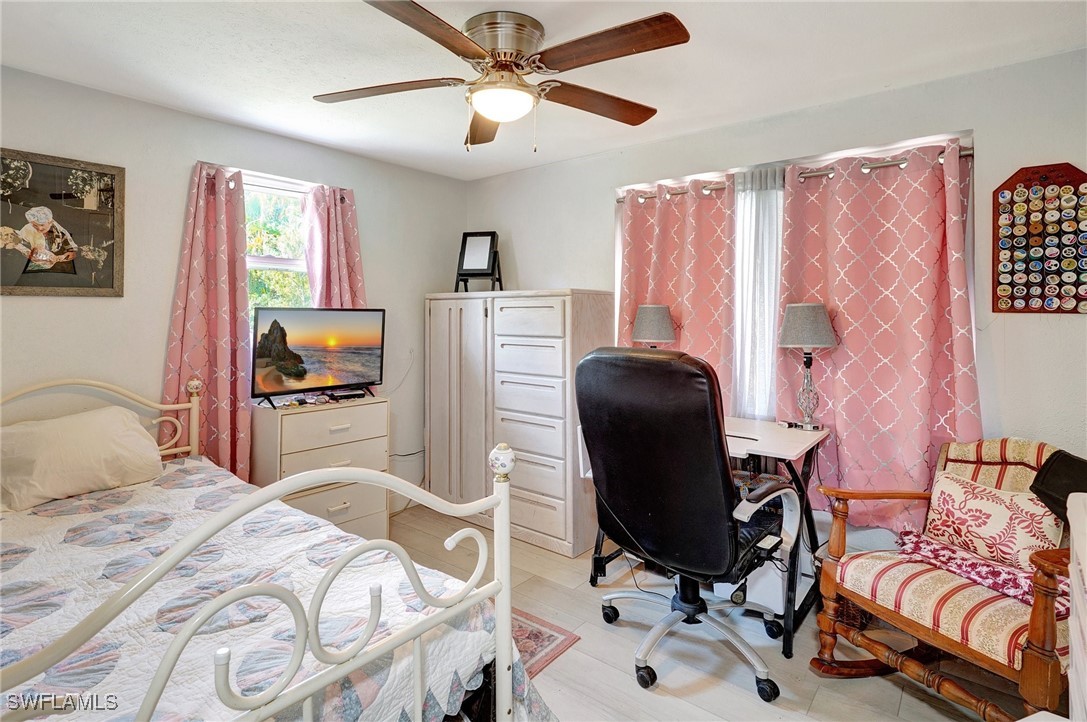 2153 Twin Brooks Road North Fort Myers, FL 33917 - Photo 23 of 31 a bedroom that has a bed and a chair in it