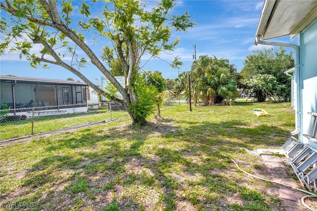 2153 Twin Brooks Road North Fort Myers, FL 33917 - Photo 27 of 31 a swimming pool with outdoor seating and yard