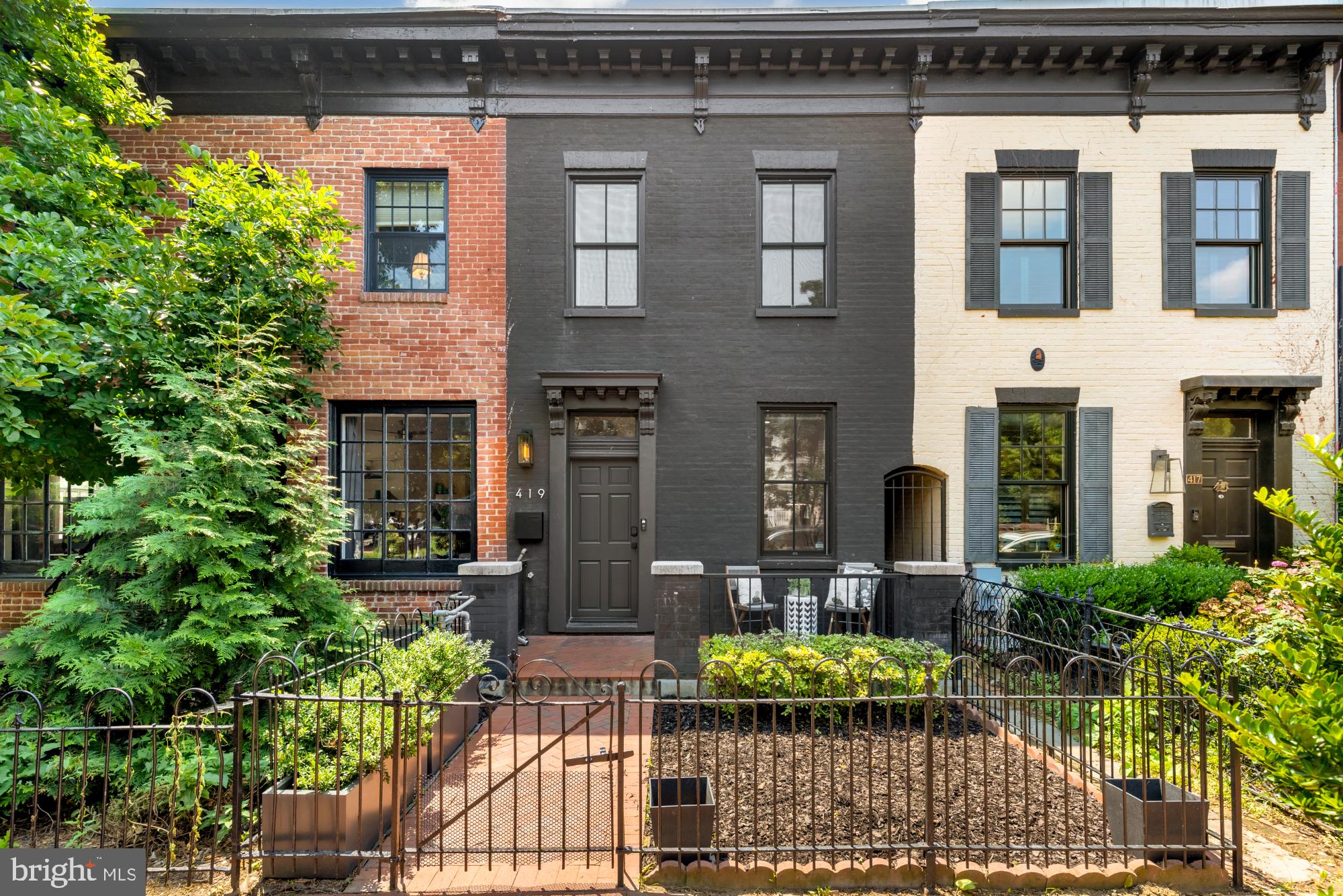 419 Independence Avenue Southeast Washington, DC 20003 - Photo 1 of 32 a front view of house and yard with green space