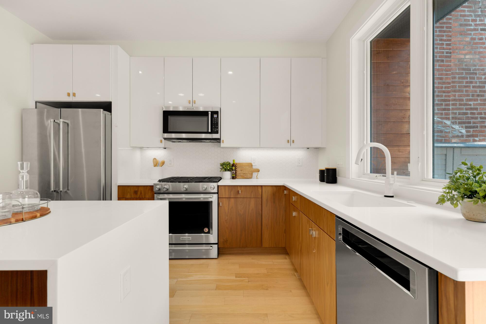 419 Independence Avenue Southeast Washington, DC 20003 - Photo 14 of 32 a kitchen with stainless steel appliances a stove sink microwave and cabinets