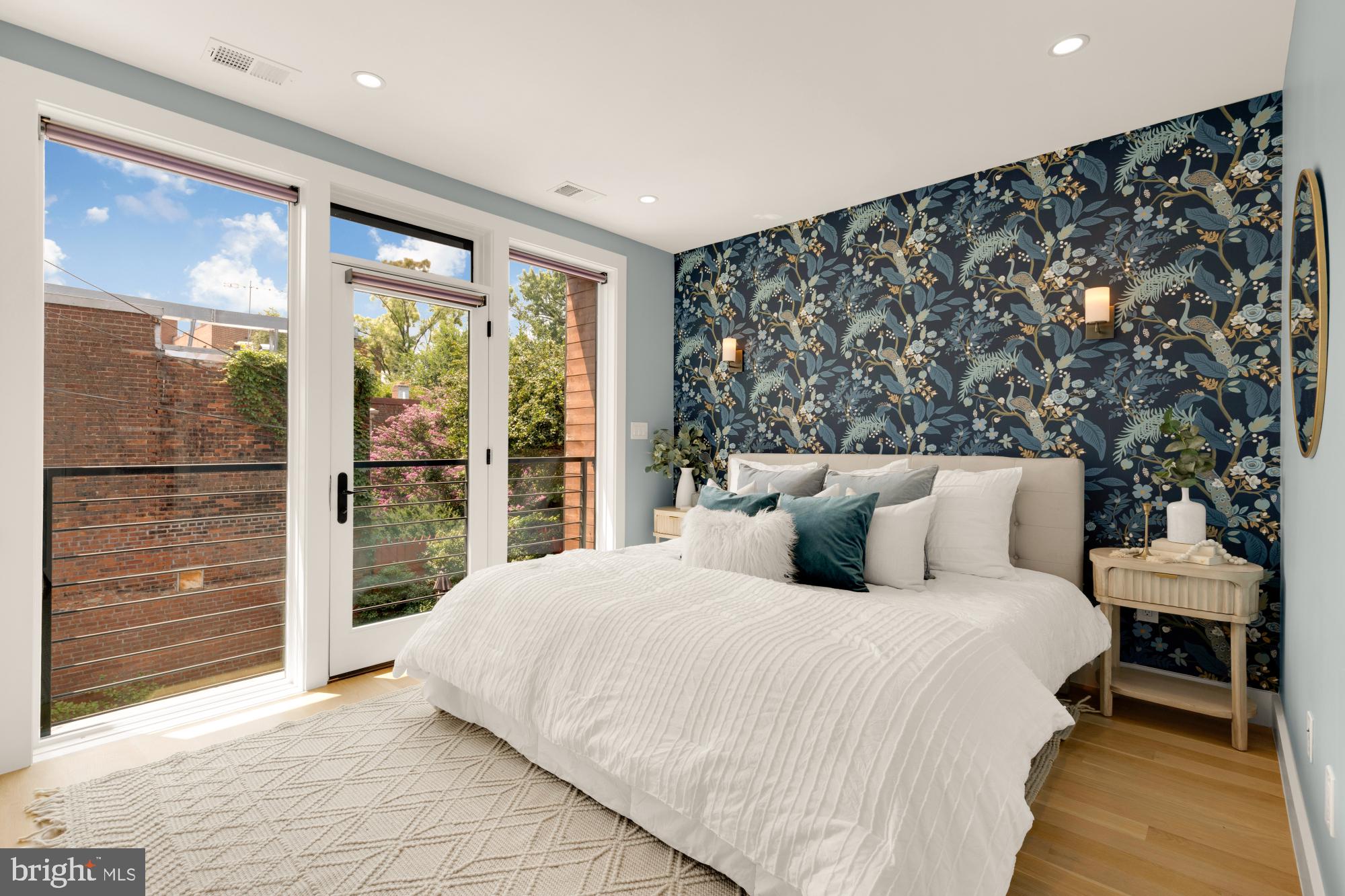 419 Independence Avenue Southeast Washington, DC 20003 - Photo 16 of 32 a bedroom with a large bed and a large window