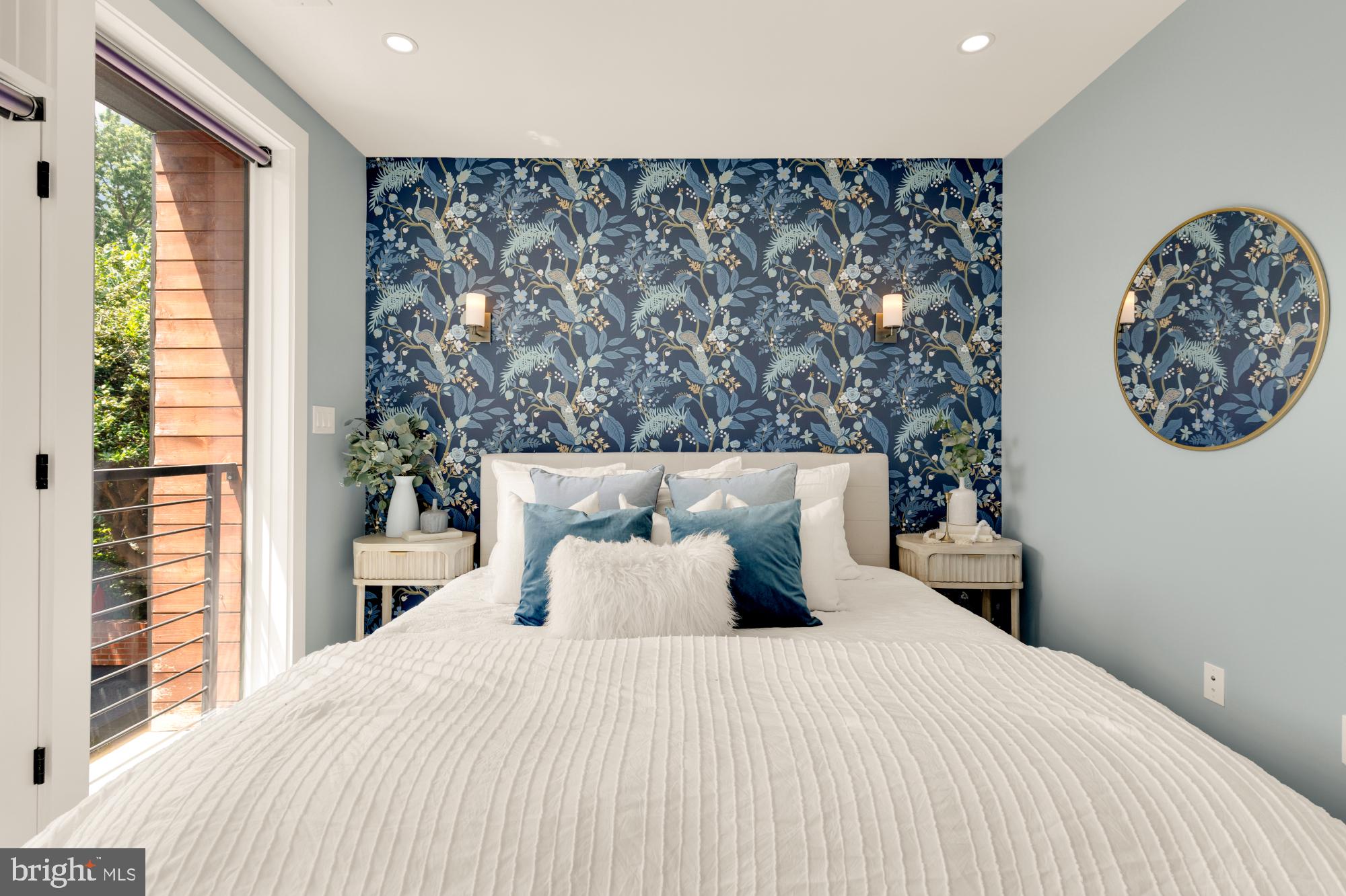 419 Independence Avenue Southeast Washington, DC 20003 - Photo 17 of 32 a bedroom with a large bed and a large window