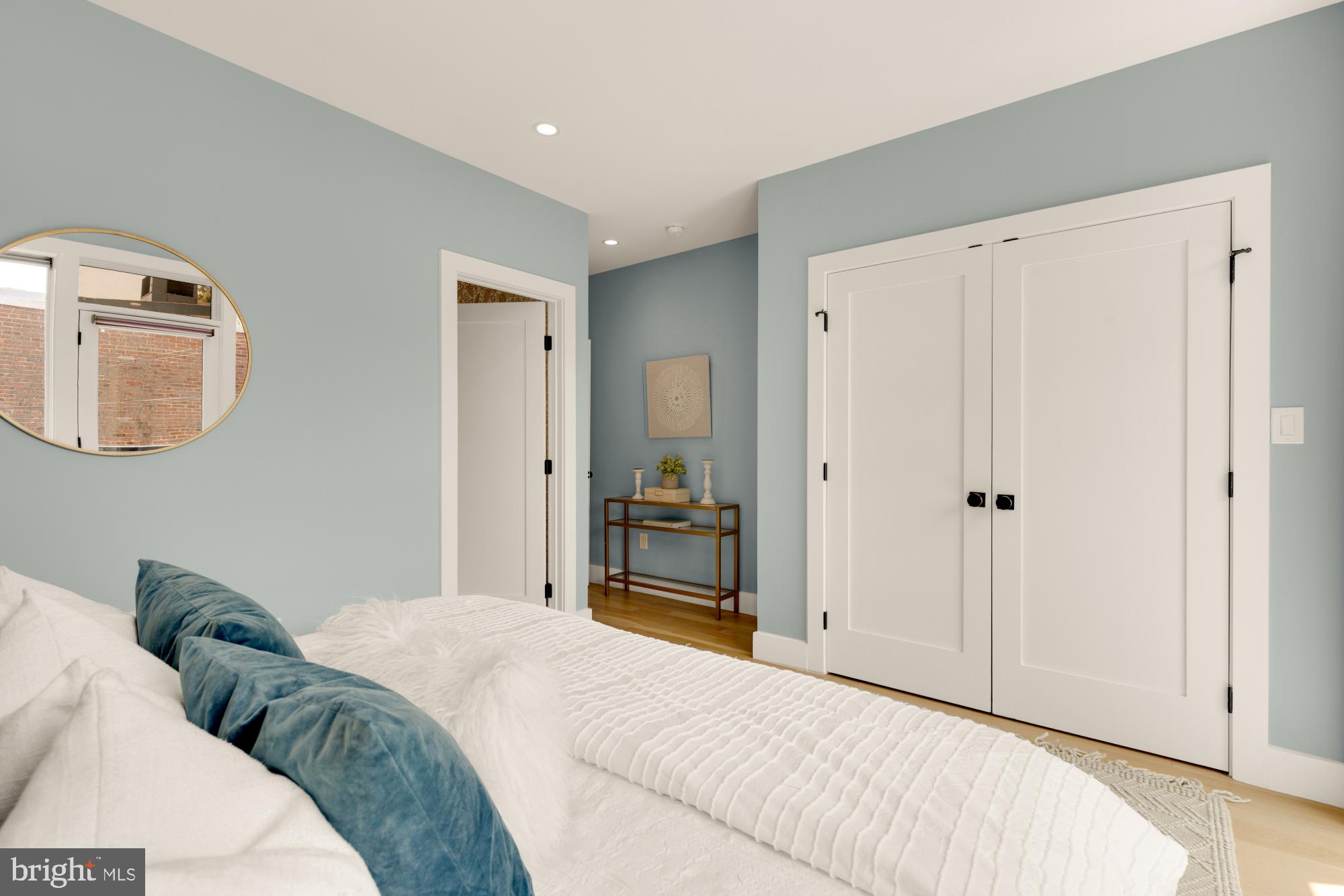 419 Independence Avenue Southeast Washington, DC 20003 - Photo 18 of 32 a bedroom with a bed and a mirror