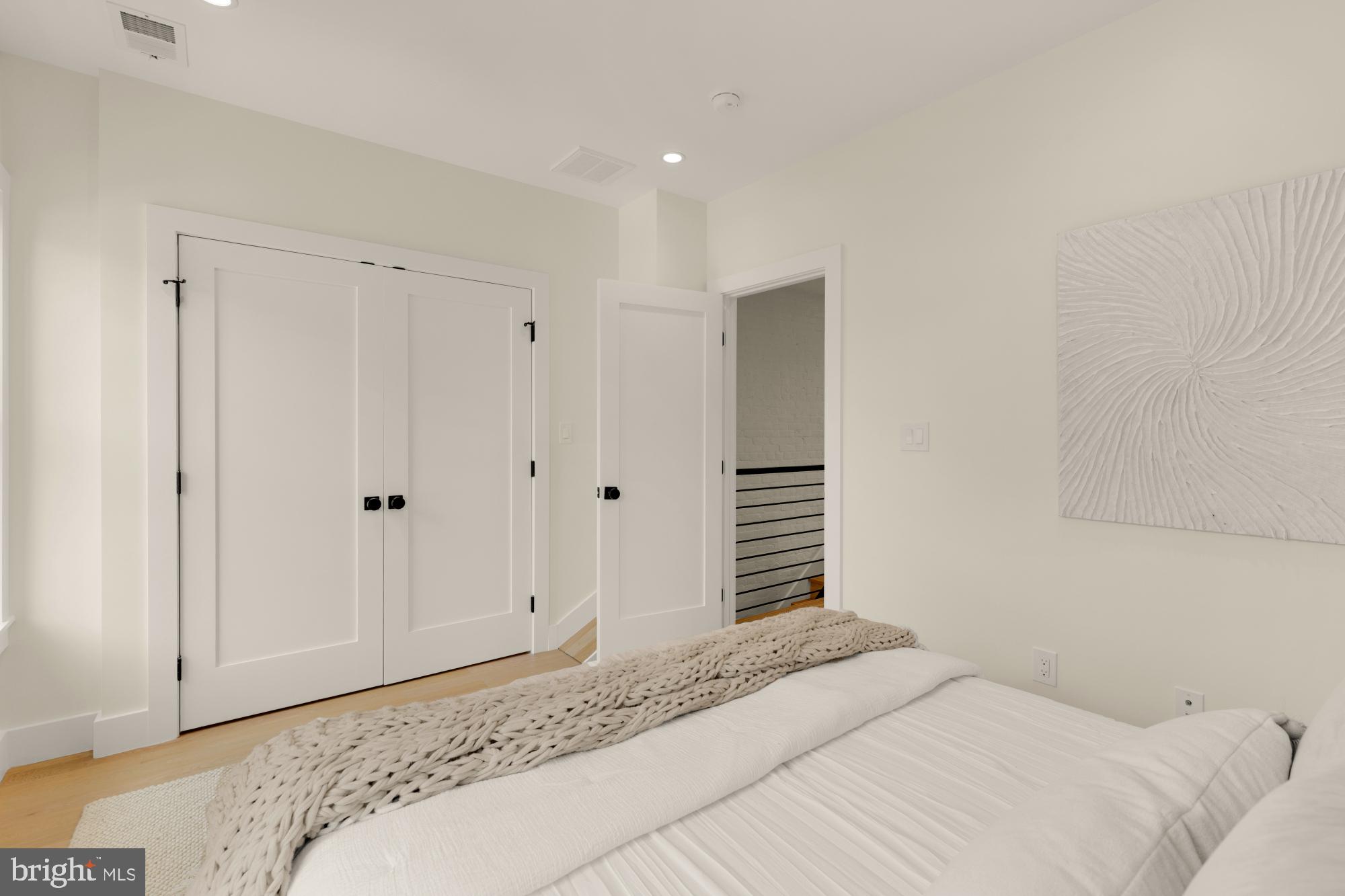 419 Independence Avenue Southeast Washington, DC 20003 - Photo 23 of 32 a bedroom with a bed and a cabinet