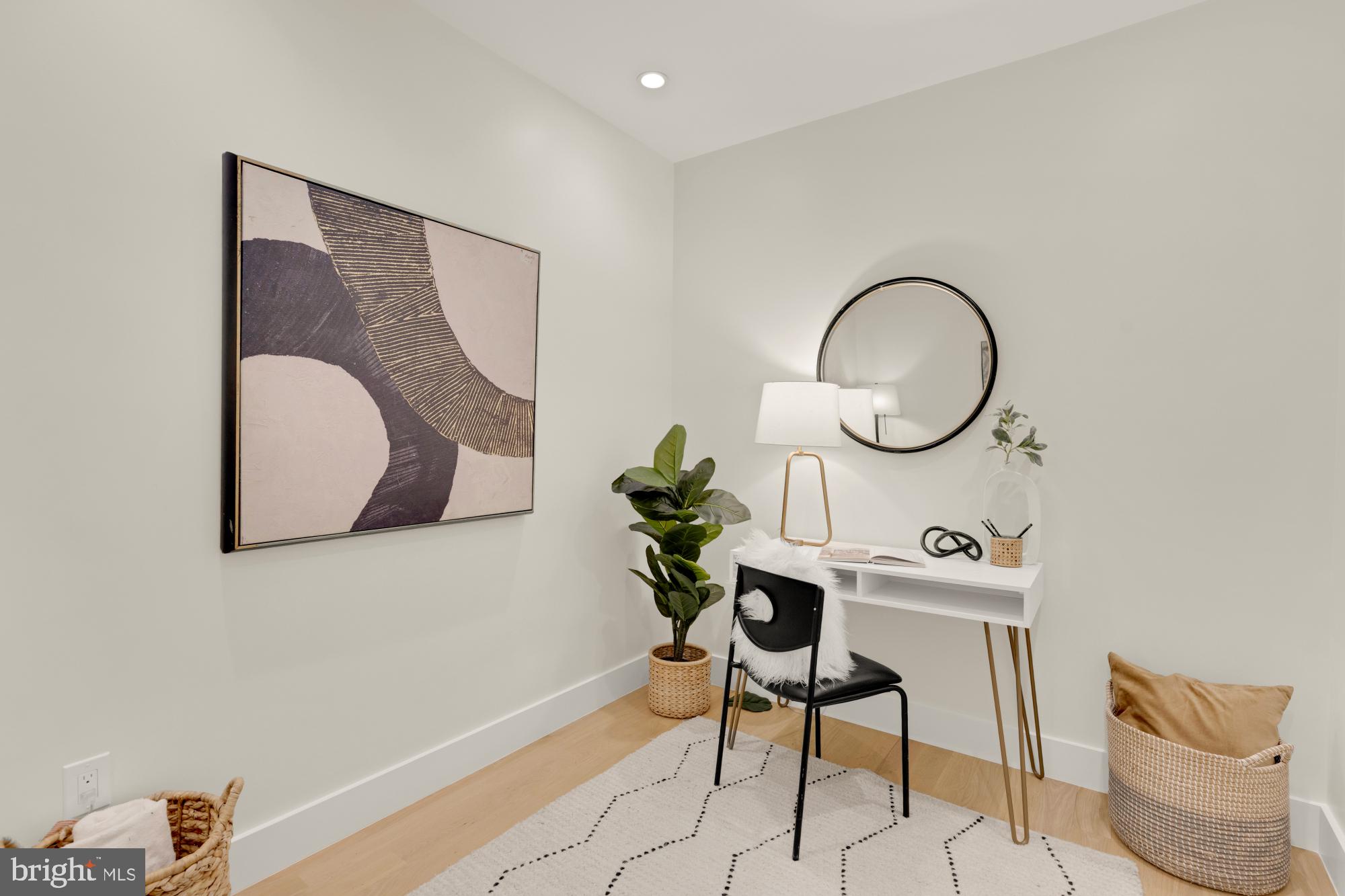 419 Independence Avenue Southeast Washington, DC 20003 - Photo 26 of 32 a room with wooden floor a mirror and a potted plant