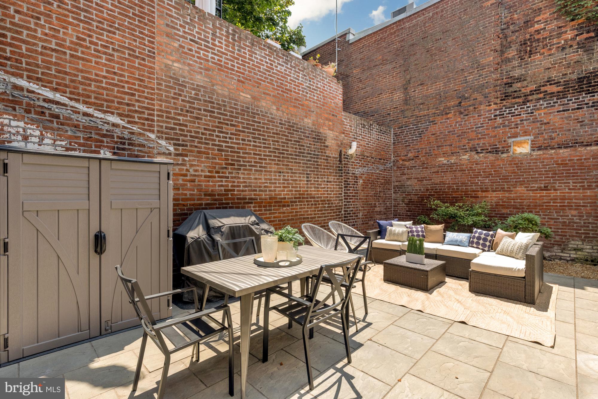 419 Independence Avenue Southeast Washington, DC 20003 - Photo 29 of 32 a backyard of a house with outdoor seating