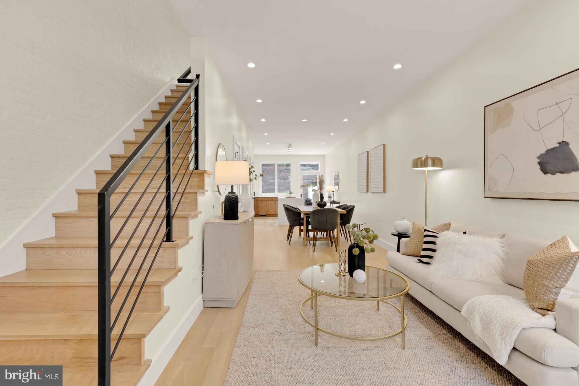 419 Independence Avenue Southeast Washington, DC 20003 - Photo 3 of 32 a living room with furniture and a chandelier