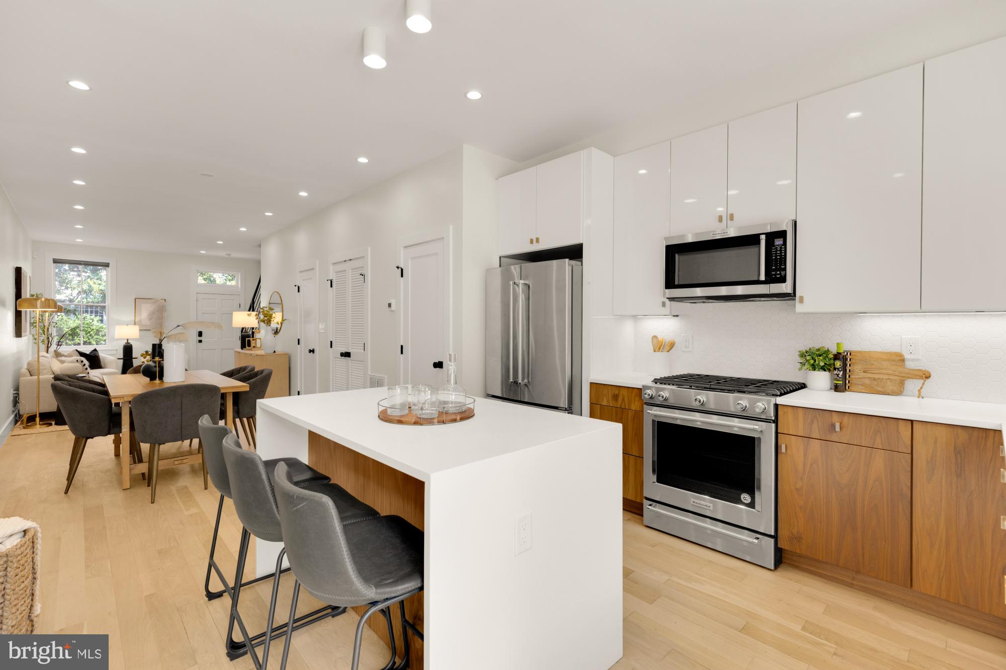 419 Independence Avenue Southeast Washington, DC 20003 - Photo 9 of 32 a large kitchen with kitchen island a sink table and chairs