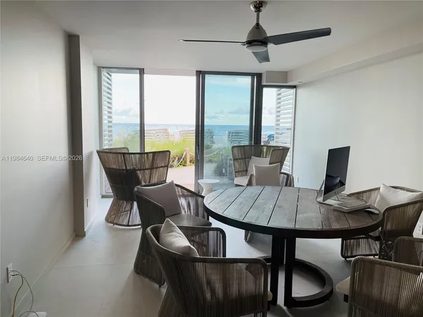 a view of a dining room with furniture window and outside view