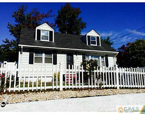 128 Raritan Boulevard Old Bridge, NJ 07735 - Photo 1 of 15 a front view of a house with a porch