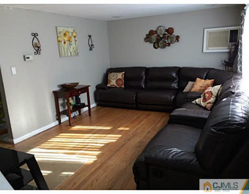 128 Raritan Boulevard Old Bridge, NJ 07735 - Photo 3 of 15 a living room with furniture