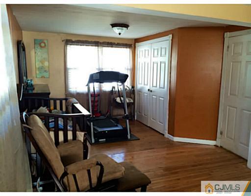 128 Raritan Boulevard Old Bridge, NJ 07735 - Photo 6 of 15 a view of a livingroom with furniture and window