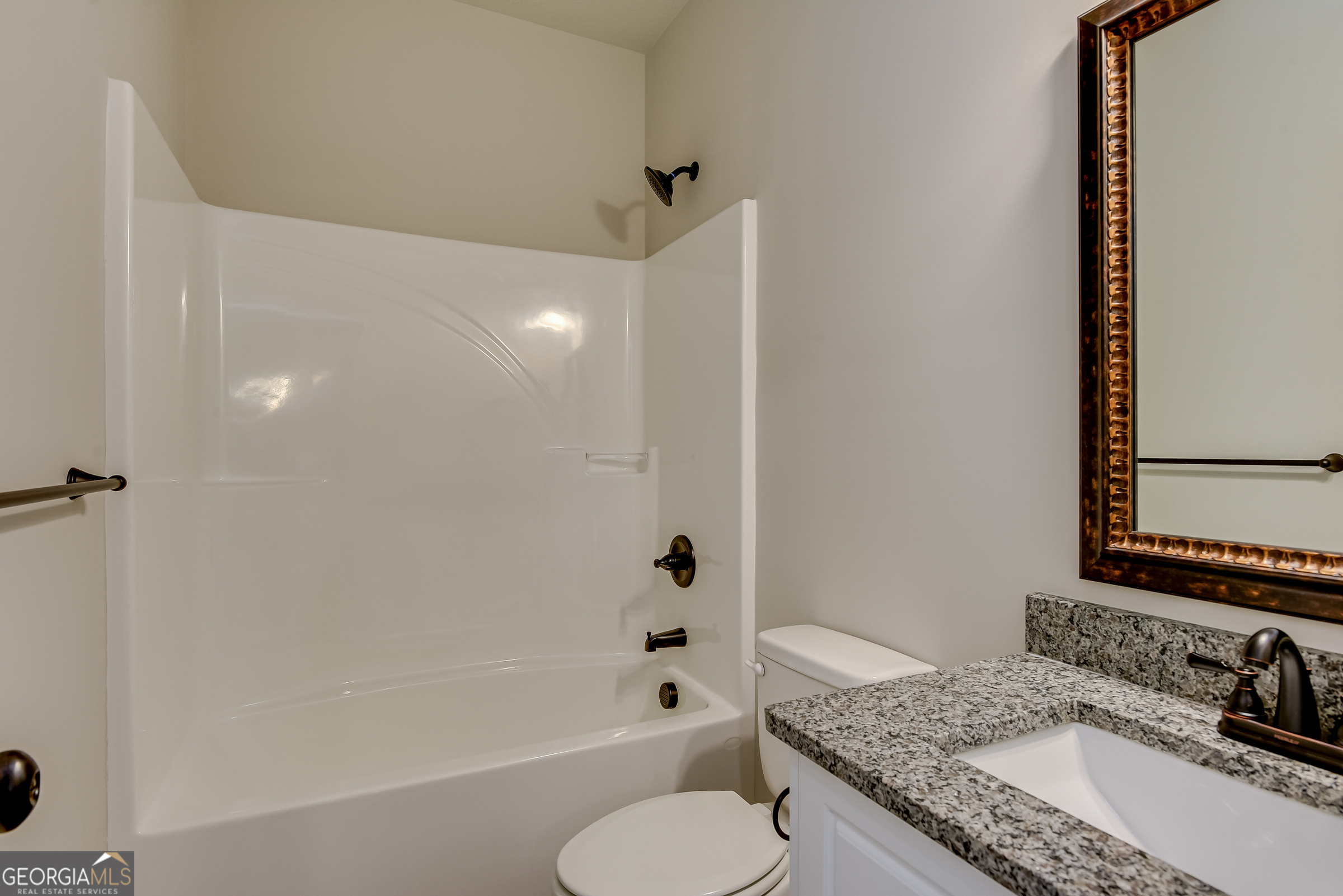 0 Peach Lane Edgefield, SC 29824 - Photo 8 of 14 a bathroom with a granite countertop sink toilet and shower