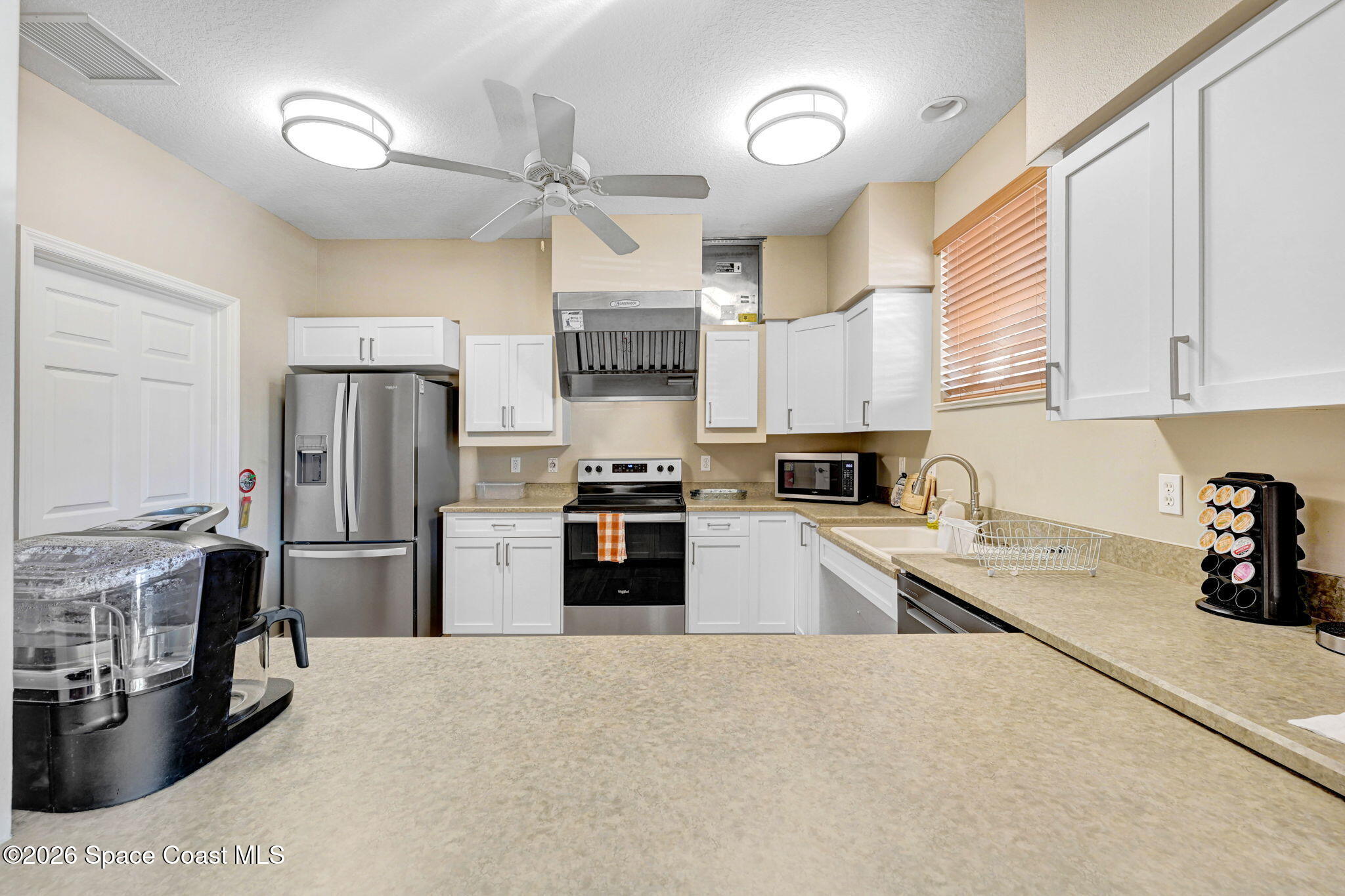 490 Sail Lane, Unit 301 Merritt Island, FL 32953 - Photo 47 of 53 Clubhouse Kitchen