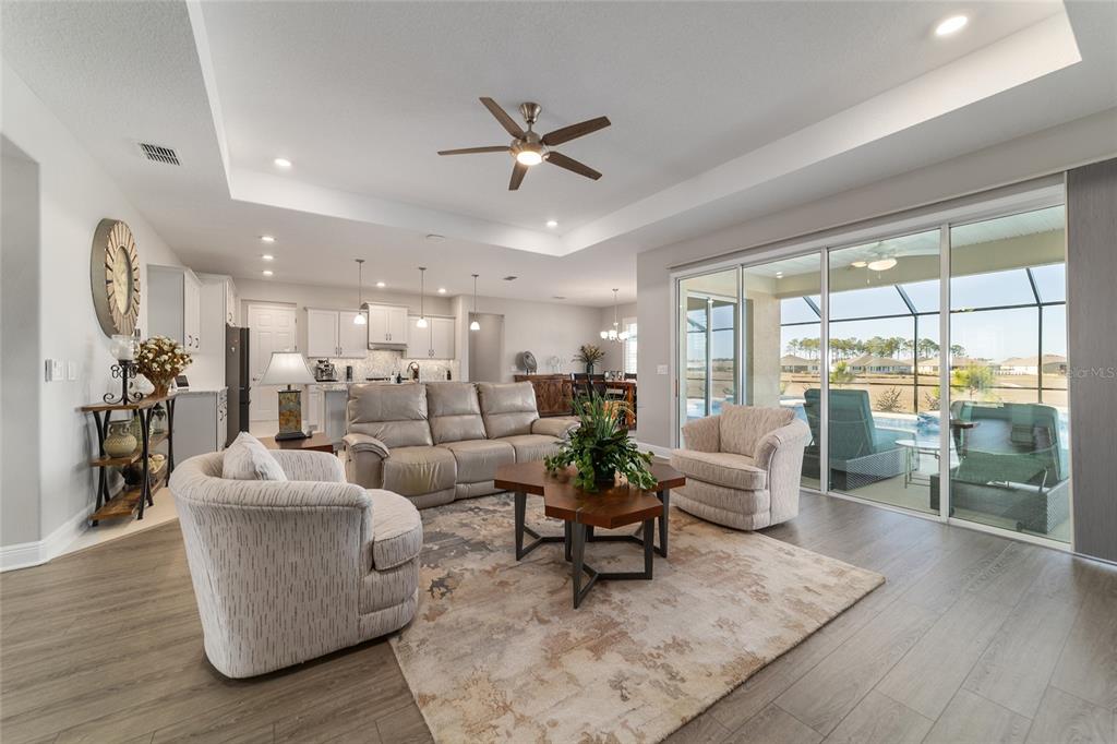 9681 Southwest 82nd Street Road Ocala, FL 34481 - Photo 11 of 62 a living room with fireplace furniture and a large window