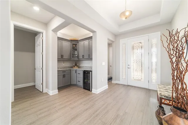 a spacious bathroom with a double vanity sink a mirror and a shower