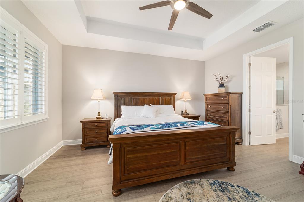 9681 Southwest 82nd Street Road Ocala, FL 34481 - Photo 21 of 62 a bedroom with a bed and wooden floor