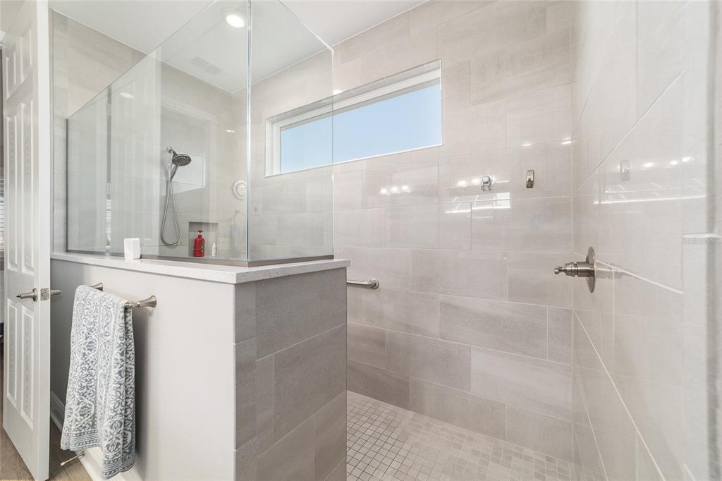 9681 Southwest 82nd Street Road Ocala, FL 34481 - Photo 24 of 62 a bathroom with a shower sink and mirror