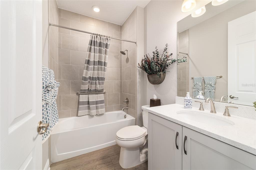 9681 Southwest 82nd Street Road Ocala, FL 34481 - Photo 26 of 62 a bathroom with a sink a toilet and shower