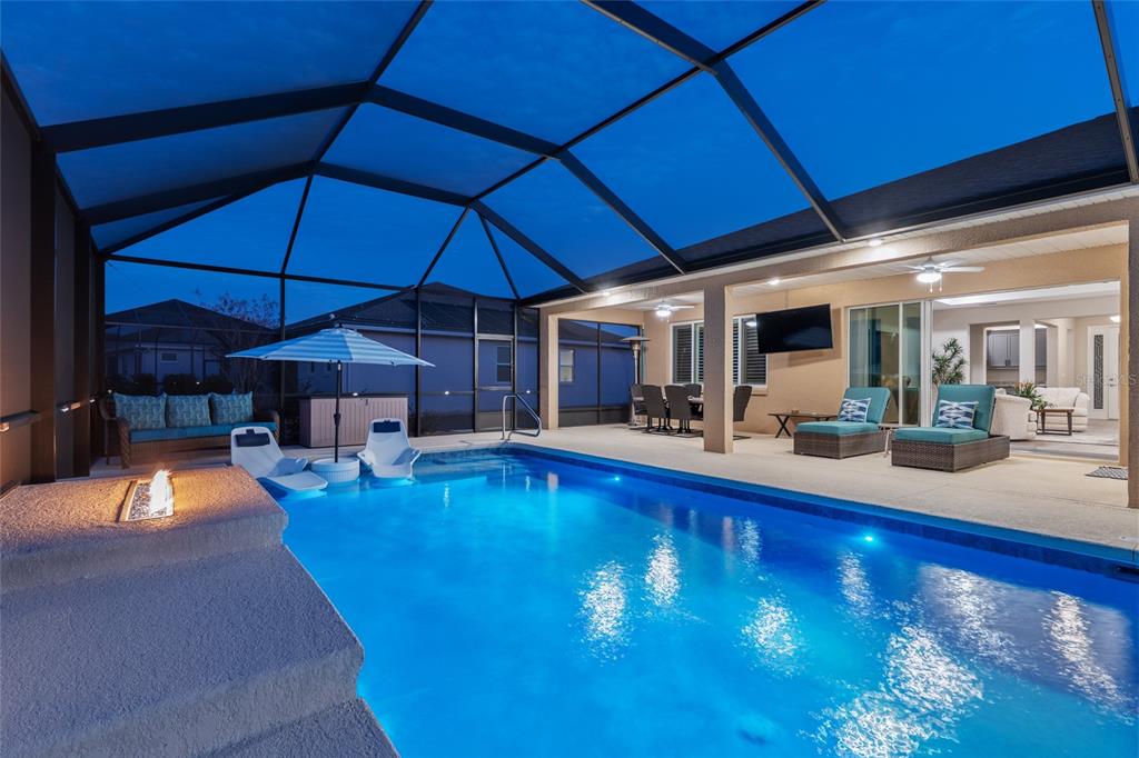 9681 Southwest 82nd Street Road Ocala, FL 34481 - Photo 3 of 62 a view of a swimming pool with outdoor seating